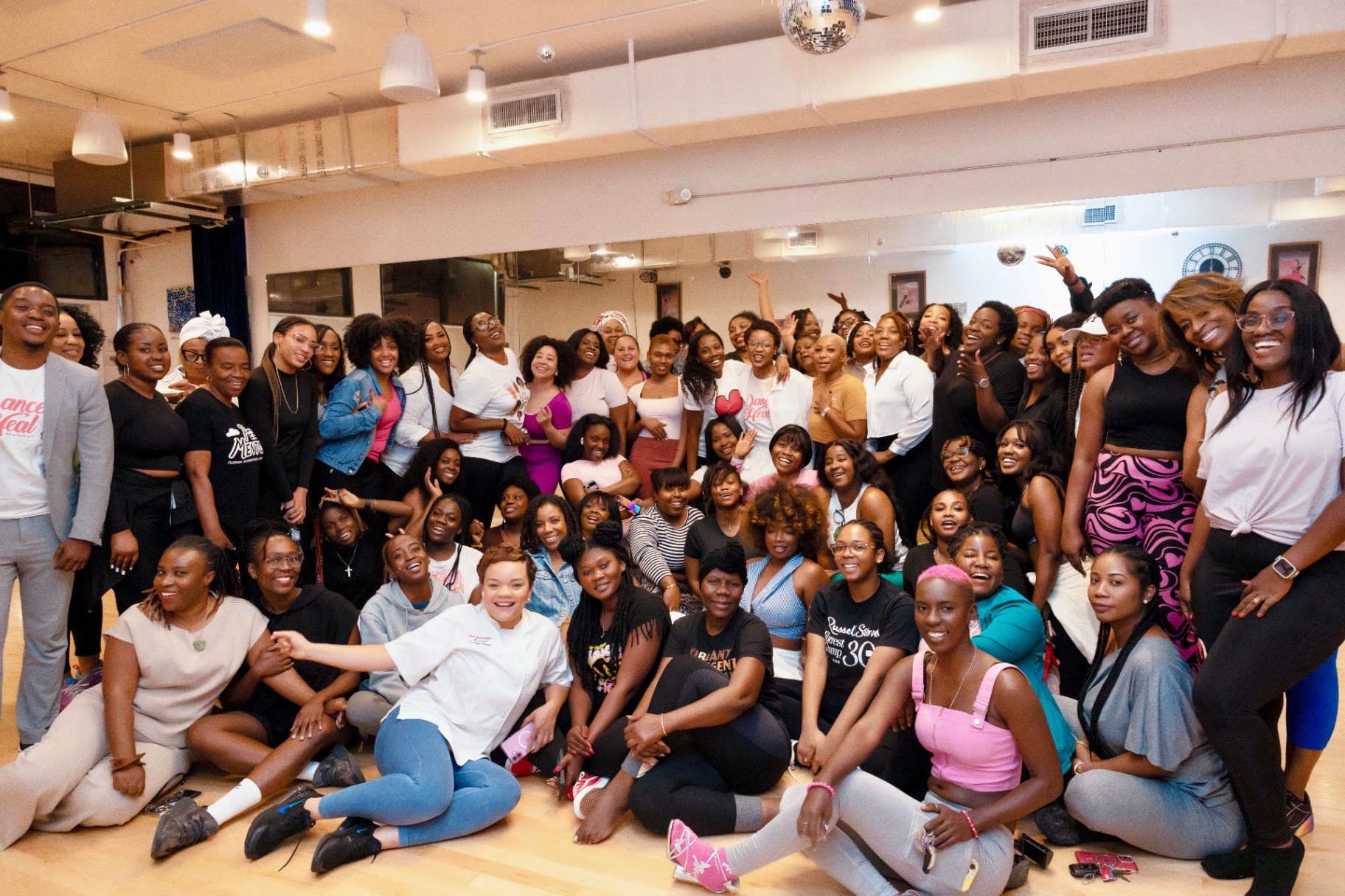 Group photo of the full Dance & Heal community celebrating together after the workshop.